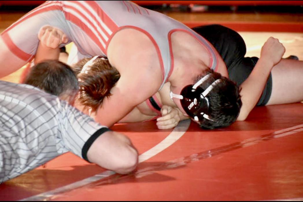 Thane Taylor wrestled in the 215# class and won over Leo Golembiewski of Chadron with a fall at 1:16.