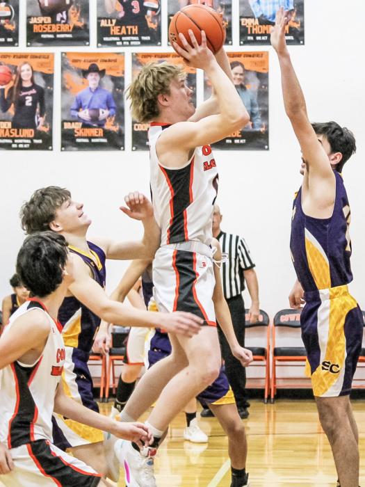 CK senior Brady Skinner goes up for a shot during subdistrict basketball action versus Sioux County. The Cowboys defeated the Warriors 62-37. Photo by Zoey Dorian