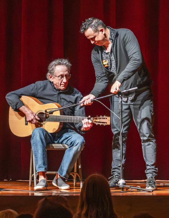 Here Daniel adjusts the mic stand for special guest accompanist Glenn Bitner of Valentine.