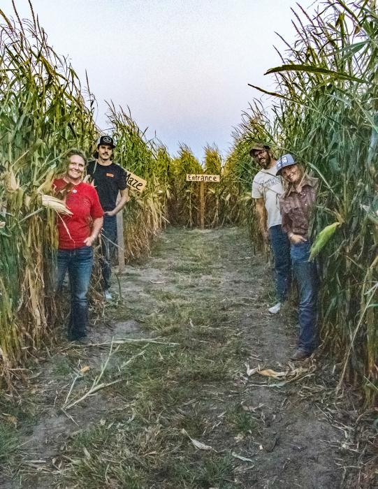 Children of the Corn? Nope, it’s the Bowen family of Ainsworth creating family fun in the middle of the Sandhills. Pictured above Becky, Tristan, J.W., and Bailey Bowen. Photo by Tina Boone