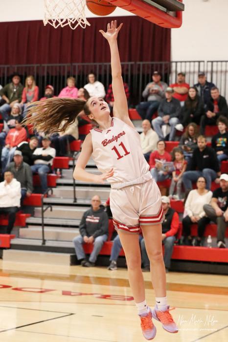 Pictured at the Badger-Gordon game are top left, Boone Jespersen #1 up for 2 points; at right, Paige Sprenger #11 with a lay-up - and breaking her point record. Photos by Nina Maria Nelson