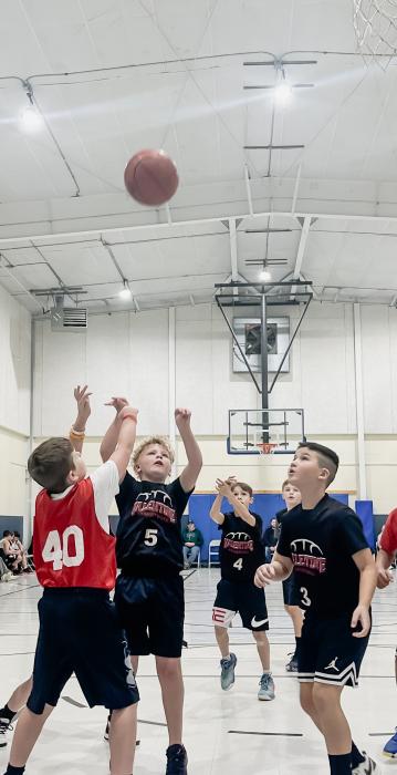 Fourth grader Cameron Wackler takes a shot and Blake O’Kief is ready for the rebound during the 4th grade vs Ainsworth game, which Valentine won 32-4 .