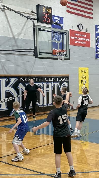 Sixth grader Cruz Joseph shoots a 3 pointer and makes it during the game vs NCYA. Valentine won 32-4.