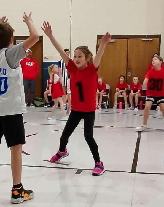 Fourth grader Camille King shoots and scores a lay-up during the 4th grade girls game vs NCYA. Fourth graders went 1-1 on the day with a win against NYCA and lost to Stuart.