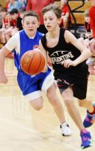 Sixth-grader Banks Beebout on a fast break in the Badgers game three of the Round Ball tournament against Gordon Rushville. Photo by Julie Liddy