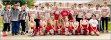 Dick Shamis was named Hometown Hero and is pictured flanked on either side by VHS cheerleaders.