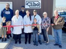 Pictured at the Meat and Complete LLC Ribbon Cutting are back row, L to R: Chris Hernstrom, Jerry Fullerton. Front row, L to R - Grace Luthy, Eve Luthy, Kate Fullerton, Chelsea Luthy-Stoeger, Doug Stoeger, Kaylee Luthy, Nadeane Allard, and Dean Jacobs.