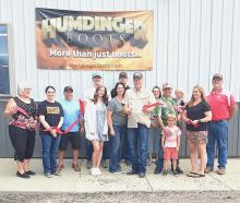 Pictured at Humdinger Boots Ribbon Cutting are from L to R: Nadeane Allard, Ann Krueger, Jason Kelber, Geoff Fisbeck, Renee Fisbeck, Nick Fisbeck, Karlanne Fisbeck, Ken Fisbeck, Janine Holmes, Tom Monroe, Karly Monroe, Jack Monroe, Deanne Holmes Monroe, and Mike Burge. Photo by Dean Jacobs