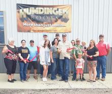 Pictured at Humdinger Boots Ribbon Cutting are from L to R: Nadeane Allard, Ann Krueger, Jason Kelber, Geoff Fisbeck, Renee Fisbeck, Nick Fisbeck, Karlanne Fisbeck, Ken Fisbeck, Janine Holmes, Tom Monroe, Karly Monroe, Jack Monroe, Deanne Holmes Monroe, and Mike Burge. Photo by Dean Jacobs