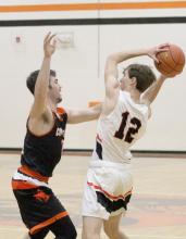 Gage Davis #0 does his best to block his opponent in the game against Crawford. Photo by Shontell Roseberry
