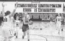Kailee Kellum is going in around her defender for a shot Photo by Mary Reagle