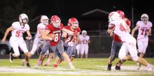 Parker Chavez is making a run for the Badgers against Amherst in the game held Friday, October 10, 2025. Photo by Nina Maria Nelson