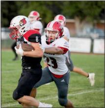 Valentine’s Tyler Whiting #23 getting ready to tackle Chadron’s #8.