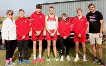 Pictured are from L to R: Coach Tammy Gass, Isaac Utecht, Isaac Cronin, Grant Springer, Deklin Titus, Will Sprenger, and Coach Jensen. The Badger Boys XC team is State Bound! Congratulations! Photo by Amanda Long