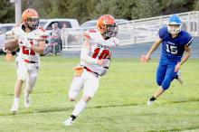 Jasper Roseberry #21, follows blocker, Cooper Fay #10, to the endzone. Photos by Shontell Roseberry