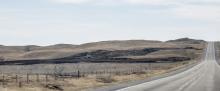 Headed south on Highway 83, the burn marks near the shoulder of the road tell a story! Attacked by several departments along with the SEAT plane from Broken Bow, the fire was limited to 283 acres at Valentine National Wildlife Refuge. A grass rig sits in a basin, ever watchful for flare-ups. Photo by Laura Vroman