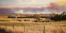 As hot spots flare up and smoke is carried along the Niobrara River Valley as people begin evacuating their homes south of Kilgore on Anderson Bridge Road. The fire began Thursday, March 12, at approximately 3:30 p.m. MST. In all, over 17,000 acres burned. Photo by Tina Boone