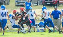 Jasper Roseberry clears a path for #10 Cooper Fay in the home game against Wallace Wildcats, Friday, August 26, 2022. Photos by Shontell’s Smiles