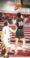 Caden Stankoski Senior lay up. Photo by Nina Maria Nelson
