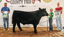 Showing the Champion Market Steer is Rietta Delaney who also had the Champion Supreme Market Beef.
