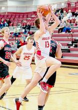 Jack Lancaster #13 goes up for some points in the game over Custer. Photo by Fletcher Larsen
