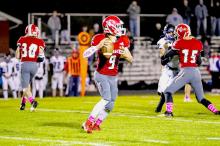 Trace Buechle #9 QB passing the ball in the game against Hershey.
