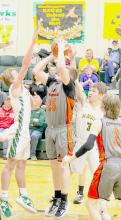 Dylan Naslund putting up a shot against Hay Springs.