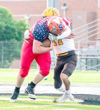 Dylan Naslund and Byron Skinner were chosen to represent the Cody-Kilgore Cowboys in the Nebraska-Wyoming 6 Man Battle at the Border. Unfortunately, Byron was unable to play after a car accident this past weekend. Nebraska got on the board early, taking the lead and remained on top for the rest of the game With a final score of 52-16. Dylan Naslund is pictured carrying the ball during the 6 Man All Star Game--Dylan scored the first touchdown for Nebraska. Photo by Shontell Roseberry