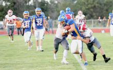 The Badgers worked together to try and bring down a Husky ball carrier. Photos by Nina Nelson