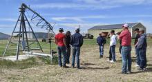 Mike Murphy and Kyle Temple are discussing pivot attributes and how they water different areas of ground coverings to the VHS FFA students. Photos by Tina Boone