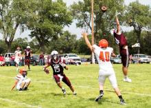CK freshman Alex Barnes waiting for a pass in action against the Stuart Bronco in Stuart, Nebraska. The top-ranked Broncos lived up to their billing, as they defeated the Cowboys 75-8. Kynzee McConaughey CKBeat