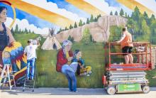 Bringing Valentine’s culture, history, and landscapes that define our area to life. Pictured are David Dorsey, Joan Swim both of the Sand Painters Art Club, and muralist Lauren Olson of Oshkosh. Photo by Tina Boone