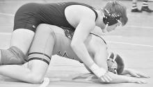 Clayton Elliott took fifth place in the 195 pound weight class where he won by a 10-5 decision over Braxgton Janda of Minden. Photos by DeanNa Fowler