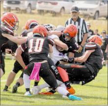 A posse of Cowboys pushing an Arthur Wolf back. Photos by Shontell Roseberry