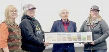 Pictured are from L to R: Debby Galloway, Pat Schemmer, Mary Eatinger, and Sand Painters Art Guild President Joan Swim.