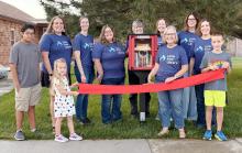 Pictured at the Little Free Library Ribbon Cutting are back row, L to R: Andy Krueger, Lindsey Little, Nichole Garwood, Rita O’Kief, Marit Kaiser, Carrie Graham, Nicole Osnes. Front row, L to R: Luke Osnes, Hannah Krueger, Chris Bitner, and Noah Krueger. Not pictured, Patty Tinant and Anne Quigley.