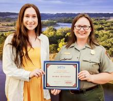 Bobbie Roshone receives the Outstanding Frontline Employee Award from Visit Nebraska.