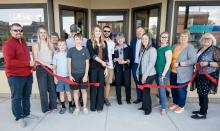 Pictured at Schuster Anderson Wealth Advisors Ribbon Cutting are back row, L to R: Linda Grimshaw, Kelly Grimshaw, Josh Benson, Cindy Schaefer, Mike Schuster. Front row, L to R: Zane Limbach, Lacey Joseph, Trey Benson, Ty Benson, Talia Benson, Paige Wood, Jenny Moore, Carolyn Moore, and Nadeane Allard. Photo by Laura Vroman