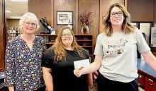 Pictured are from L to R: Janel Schubauer, Nichole Garwood, and Carrie Graham at the Valentine Public Library.