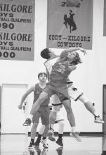 The Badgers and Cowboys go for control of the ball in the game held Tuesday, January 11, in Cody. Photo by Shontell Roseberry