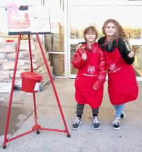 Badger Paw students volunteering to ring at Bomgaars.