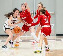 Lady Badgers guarding their opponent.