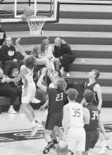 Nathan Perrett taking a shot, against Custer in the Chadron Holiday Tournament. Photos by Mary Reagle