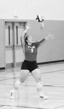 Tessa Krolikowski serves the ball in the game against Cozad Saturday, September 11, 2021. Photo by Mary Reagle
