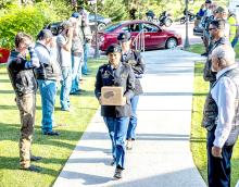 Freedom Riders lined the walkway to Sandoz Chapel of the Pines as First Sergeant Jensen, carrying the U.S. Flag, and Sergeant Hocog carried PFC Dale Thompson’s remains in a brushed gold vault. He was finally home. Photo by Laura Vroman