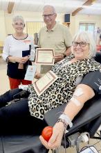 Pictured are from L to R: Blood Drive Chariman Jeanie Cozad, 100+ unit donors Dave Nelsen, and Nadeane Allard. Not pictured is Pat Greenough. Photo by Laura Vroman