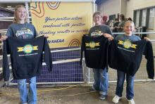 State Fair Premier Livestock Exhibitors - Maysa, Mahaya and Makamry Jones, awarded hoodies and cash awards sponsored by the Nebraska 4-H Foundation.