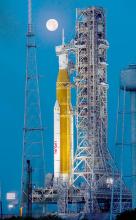 Full Moon over Artemis-1 on July 14, 2022, as the integrated Space Launch System and Orion spacecraft await testing. Photo credit: NASA/Cory Huston Source: https://www.nasa.gov/image-feature/a-full-moon-over-artemis/