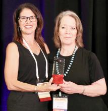 Jonnie Kusek, right, receives the SWTA Spotlight Award for her video collaboration titled Planting the Seeds of Collaboration!