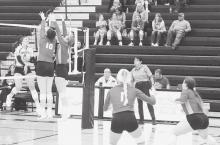 Emma Richards and Kinsey Buechle get the block at the net in the game against the Gothenburg Swedes. Photos by Mary Reagle